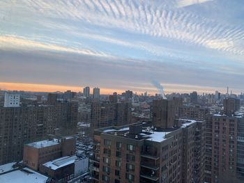 High angle view of buildings against sky during sunset