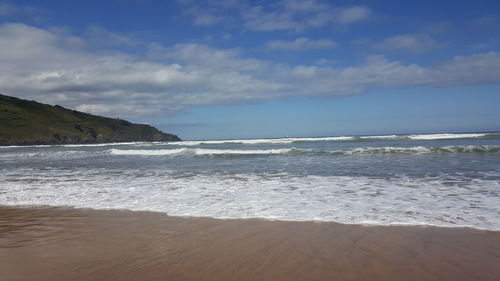 Scenic view of beach and sea against sky