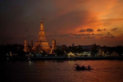 Scenic view of buildings against sky during sunset