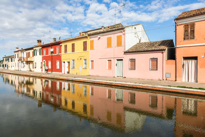 Canal amidst buildings in city