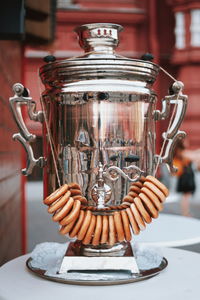 Close-up of silver trophy on table