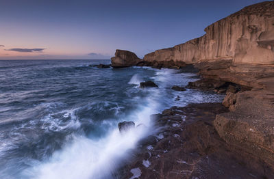 Scenic view of sea against sky at sunset