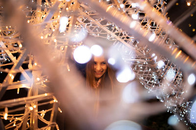 Portrait of woman with illuminated lights