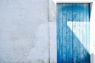 Full frame shot of wall and door with shadow