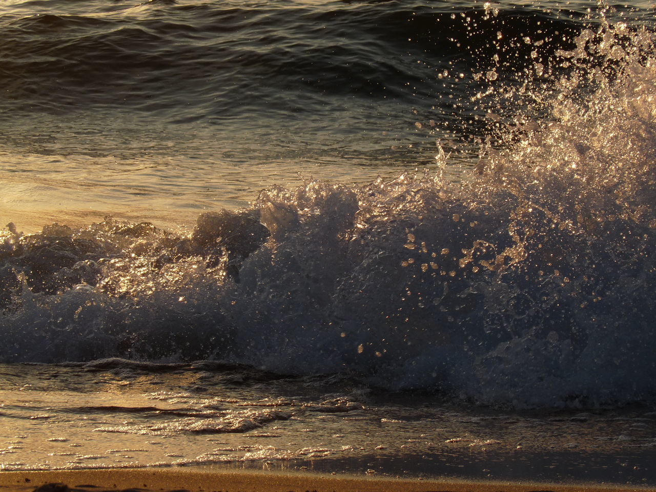 SEA WAVES SPLASHING ON BEACH