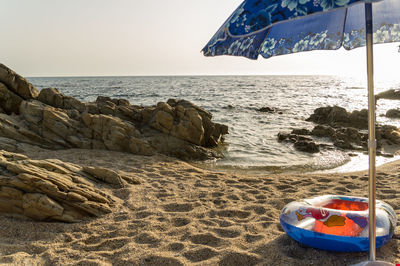 Scenic view of beach against clear sky