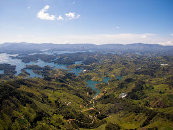 High angle view of trees and mountains against sky