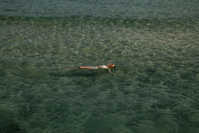 High angle view of person swimming in sea