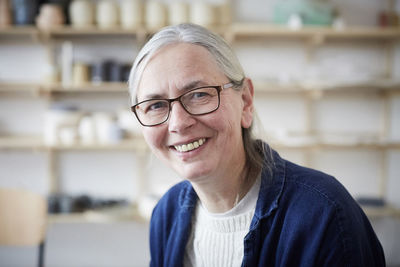 Portrait of smiling mature woman in art class