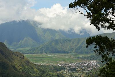 Scenic view of landscape and mountains against sky