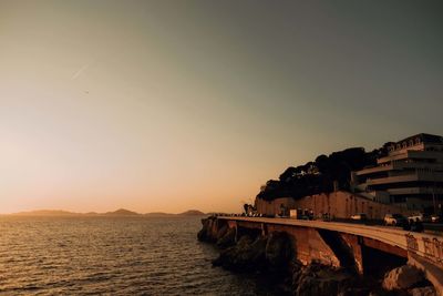 Scenic view of sea against clear sky during sunset