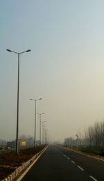 Empty road against clear sky