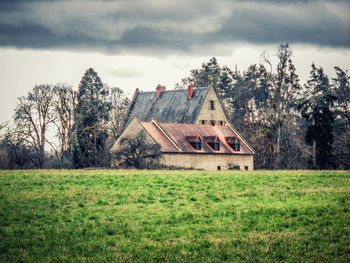 House on field against sky