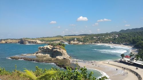 High angle view of sea and bay against sky