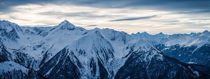 Scenic view of snowcapped mountains against sky