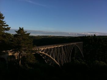 Bridge over landscape against sky