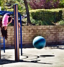 Silhouette of people on swing