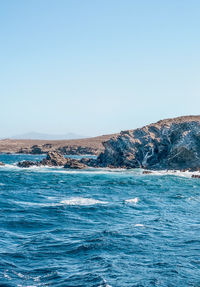 Scenic view of sea against clear sky