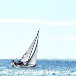 Sailboat sailing in sea