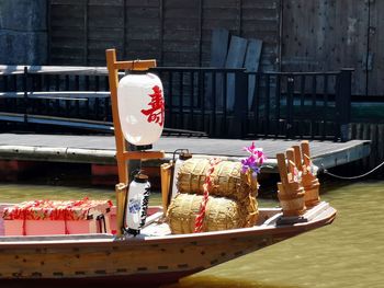 View of boats in canal by building