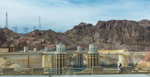 Footbridge by hoover dam against mountains