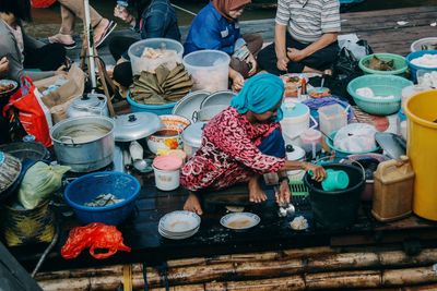 Group of people at market stall