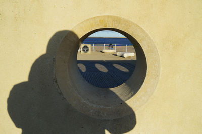 Shadow of man standing against wall