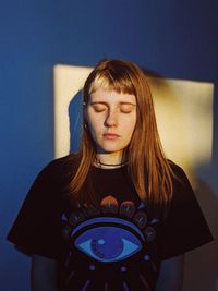 Portrait of a young woman with camera