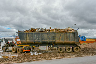 Vehicles on road against the sky