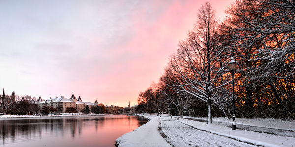 Snow covered landscape at sunset