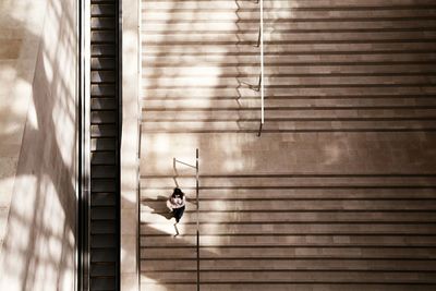 Full length of woman standing on wall