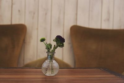 Flower vase on table at home