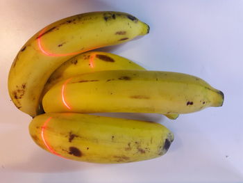Close-up of bananas against white background