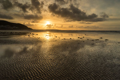 Scenic view of sea against sky during sunset