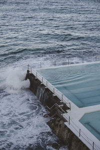 High angle view of swimming pool by sea