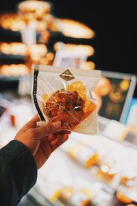 Close-up of hand holding ice cream