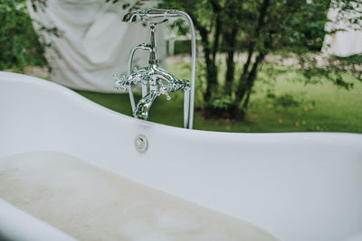 Close-up of water flowing from faucet