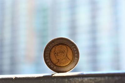 Close-up of coin on metal