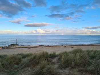 Scenic view of beach against sky