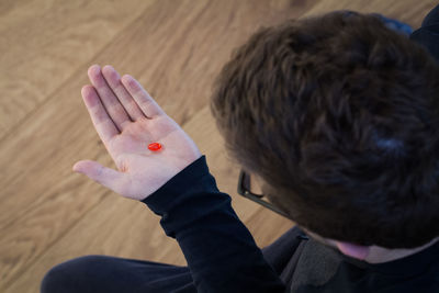 High angle portrait of man holding food