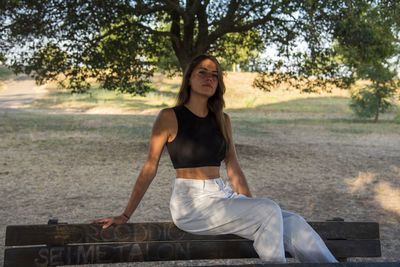 Beautiful italian girl at the park, wearing a dress