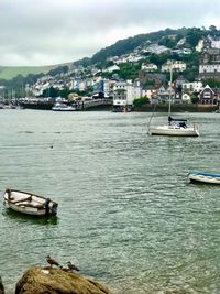 Scenic view of sea by city against sky