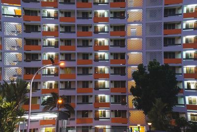 High angle view of illuminated building in city