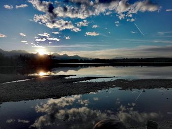 Scenic view of lake against sky during sunset