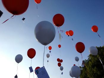 Low angle view of hot air balloons against sky