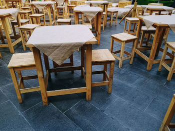 High angle view of empty chairs and table in cafe