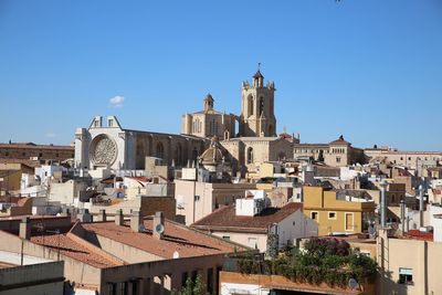 Residential buildings against blue sky