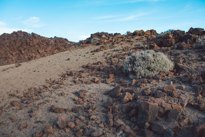 Rock formations on land against sky