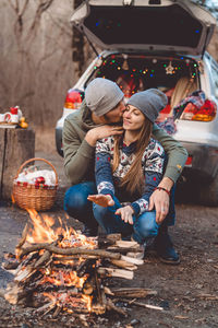Young couple sitting at market