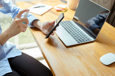 High angle view of woman using mobile phone